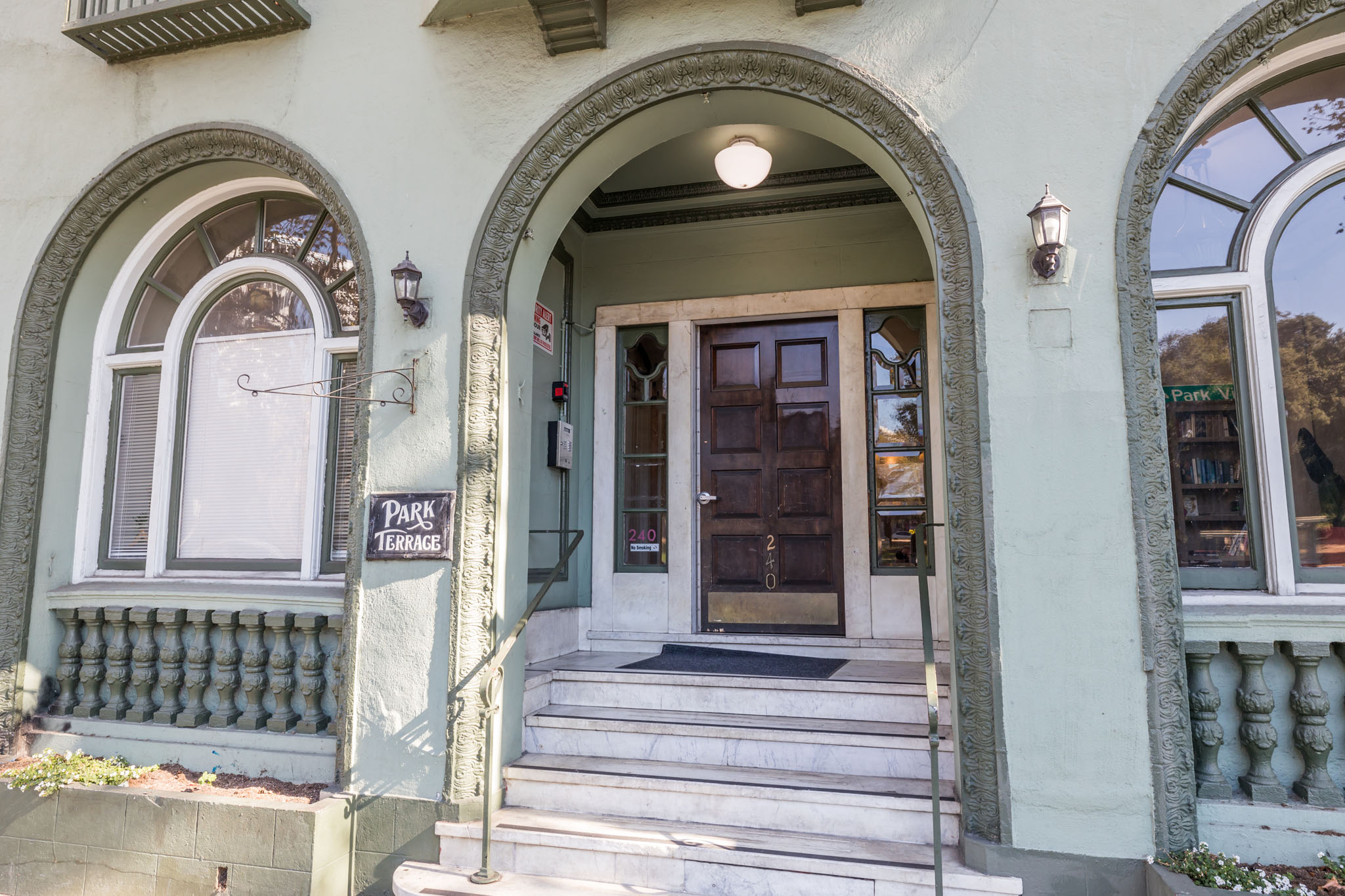 A building with a wooden door and a sign that says "PARK".