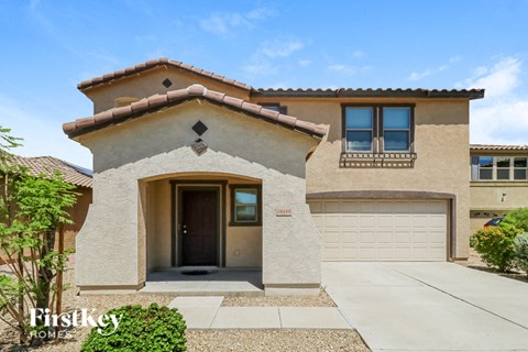 a house with a driveway and a garage door
