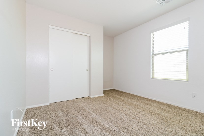 a empty room with a door and a window