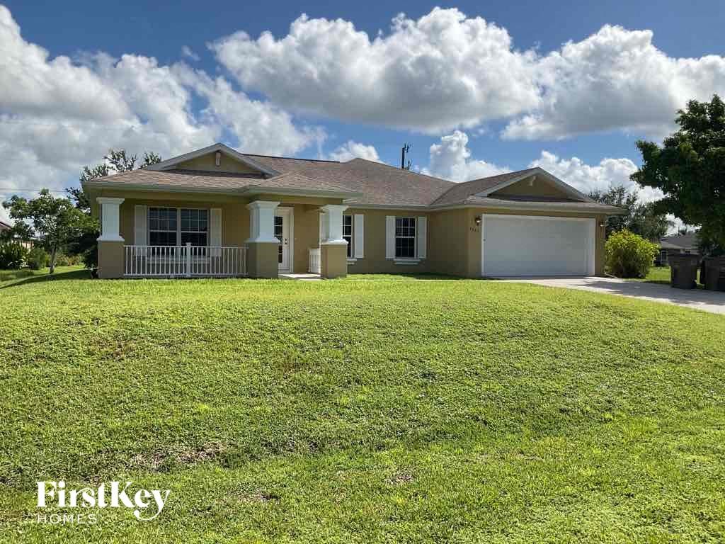A house with a lawn in front of it and the words "Firstkey" on the bottom.