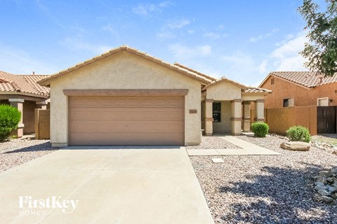 a house with a garage door in front of it