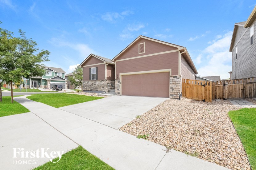A house with a brown garage door is for sale.