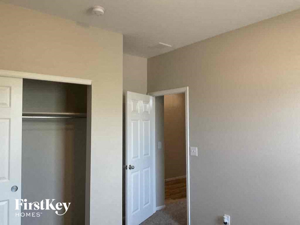 A white door is on the left and a white door is on the right.