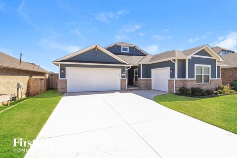 a large white driveway in front of a house