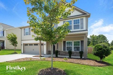 a house with a tree in front of it