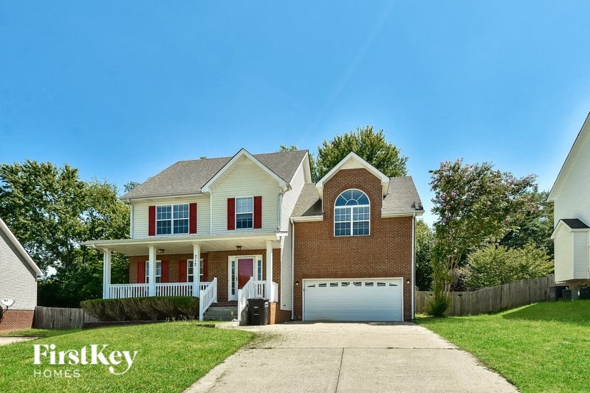 a large brick house with a white garage door