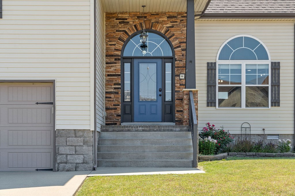 the front of a house with a blue door