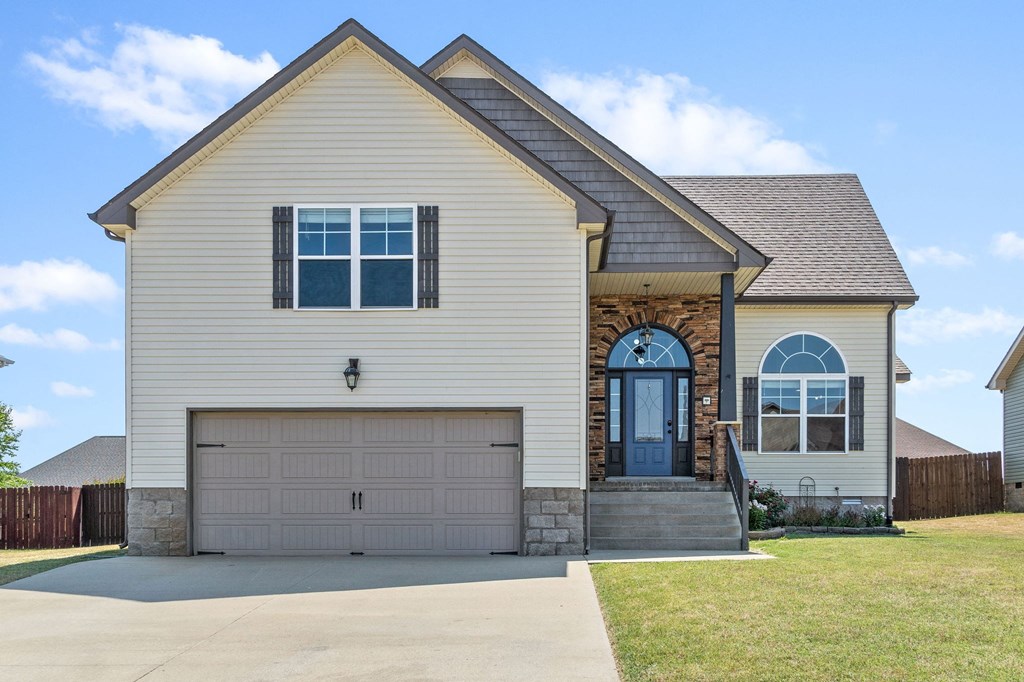 the front of a house with a garage door