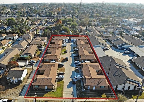 an aerial view of a neighborhood with many houses and roofs