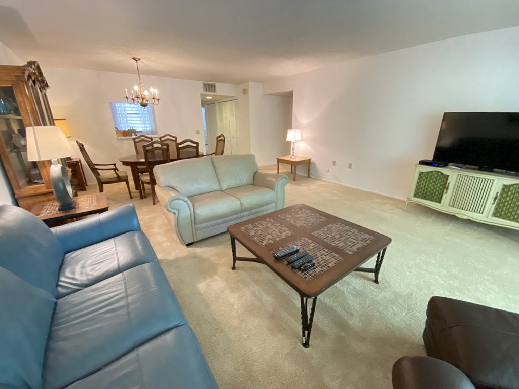 a living room with couches and a coffee table