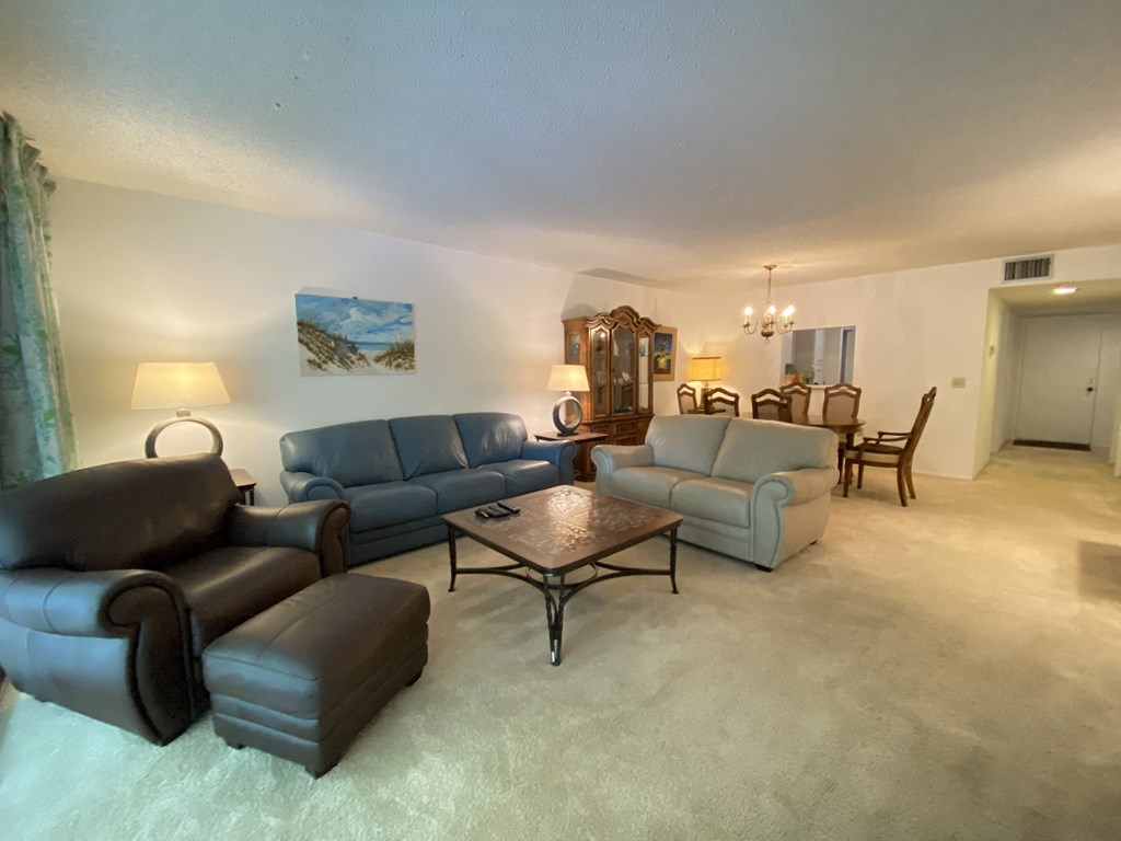 a living room with couches and a coffee table