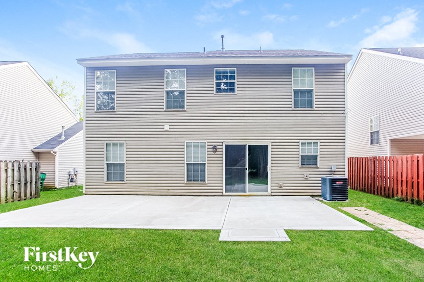 a renovated house with a driveway in front of it