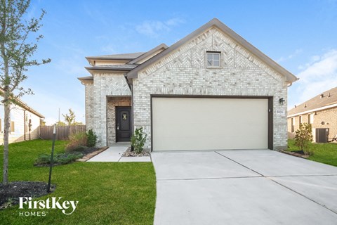 A house with a garage door is for sale by FirstKey Homes.
