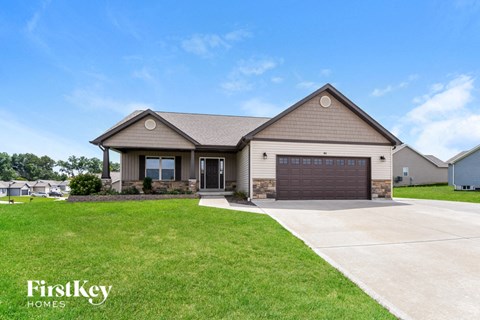 a house with a driveway and a garage door