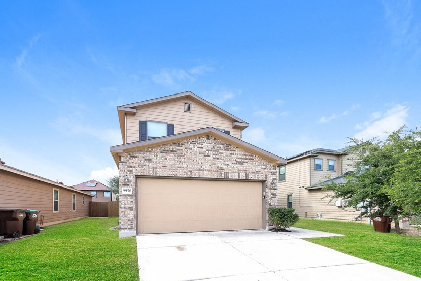 A house with a garage door in the front.