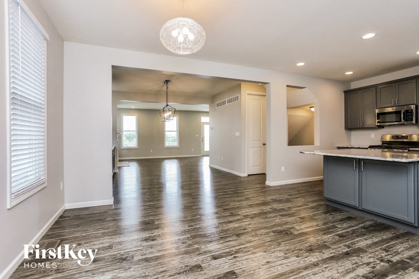 a kitchen and living room in a new home