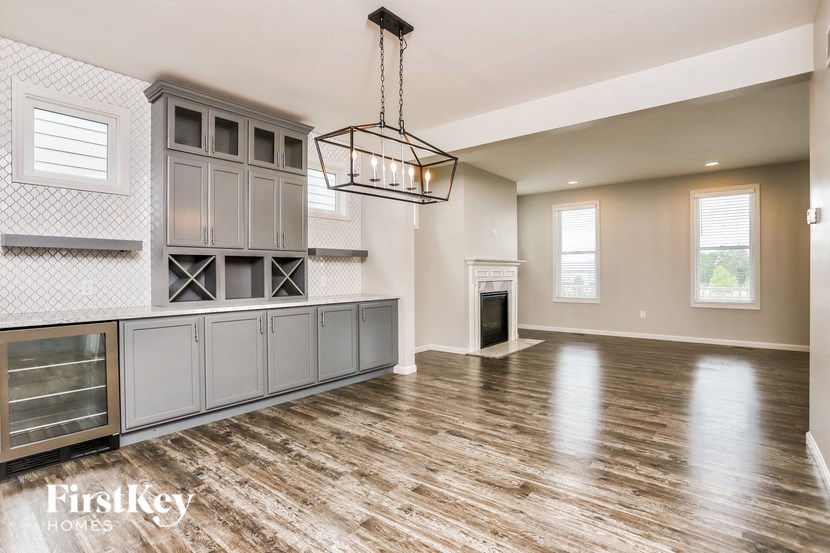 the kitchen is open to the living room and dining room