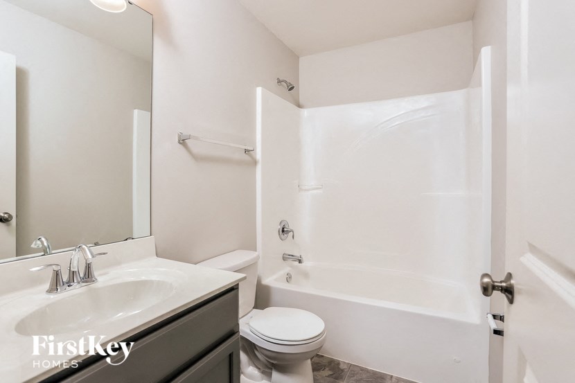 a bathroom with a sink toilet and a shower
