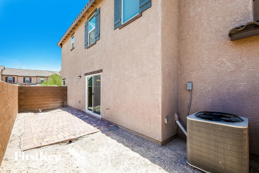 a patio with a heater outside of a house