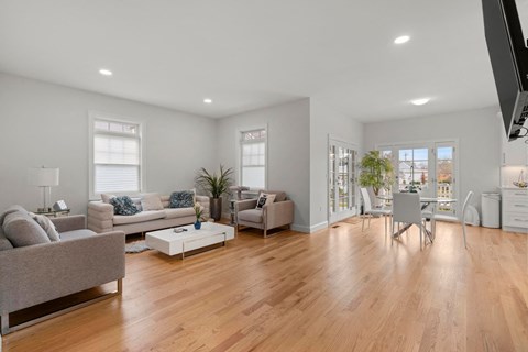 a living room with couches and chairs and a table