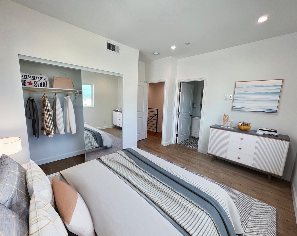 a bedroom with a bed and a closet