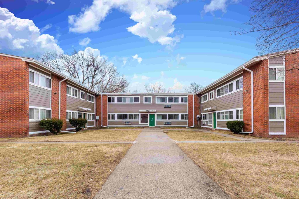 this is an image of a courtyard between two apartment buildings