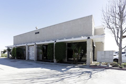 A white building with a sign that reads "P1238".