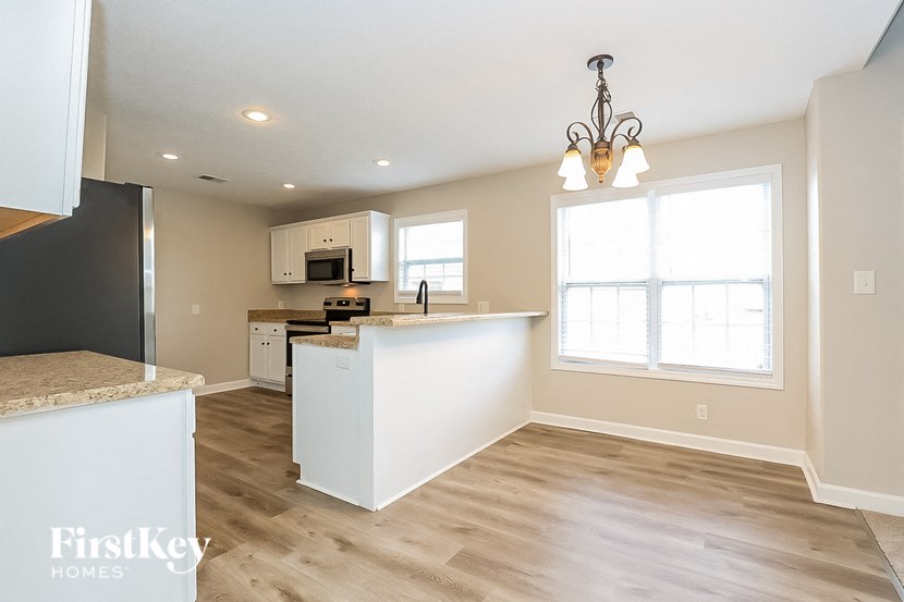 the kitchen and dining room are open to the living room