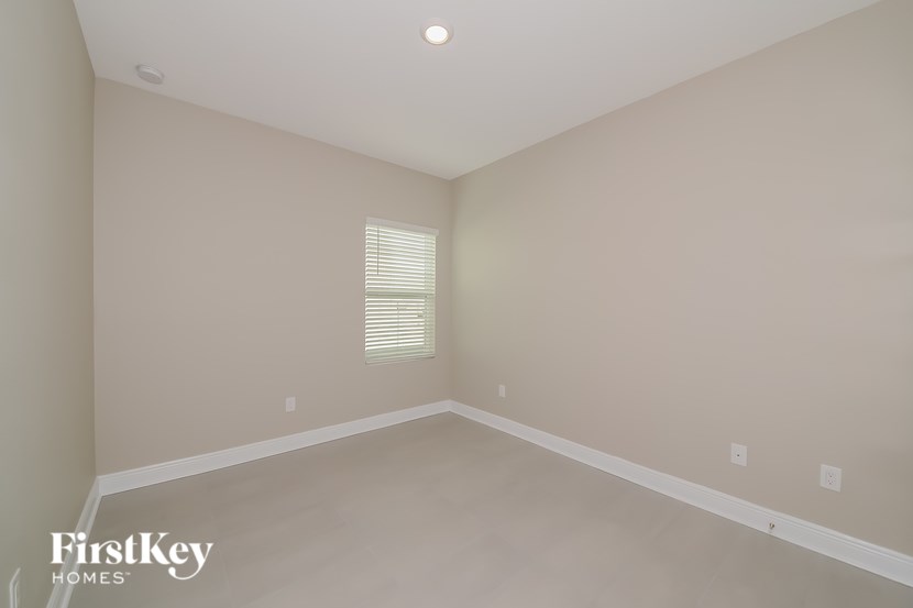 A room with a window and a FirstKey Homes logo.