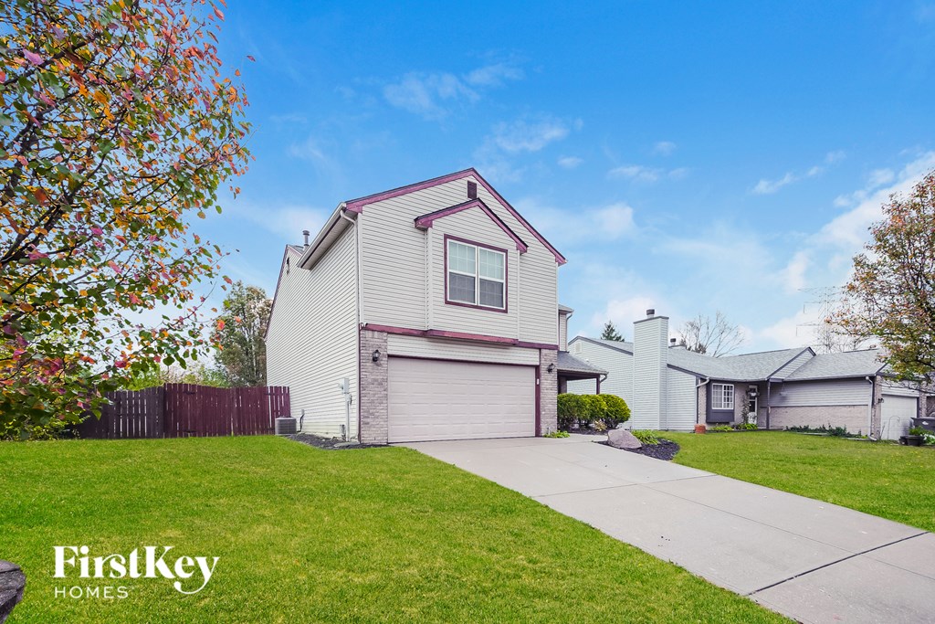 A house with a garage is for sale by FirstKey Homes.
