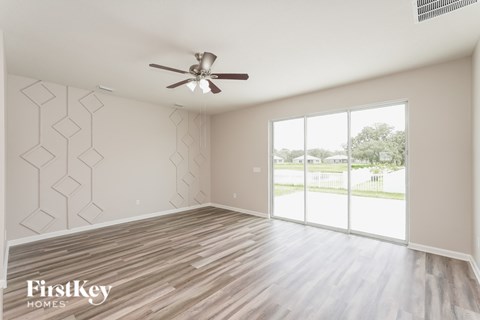 A room with a FirstKey Homes logo on the wall.
