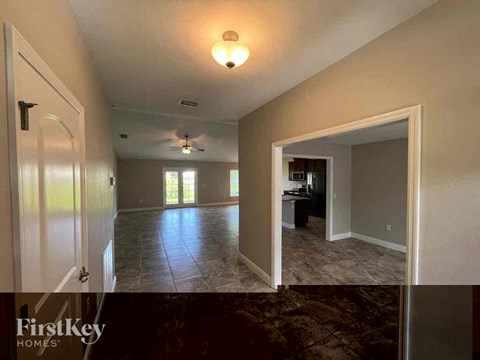 a view of the living room and dining room from the kitchen