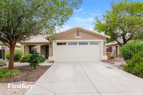 A house with a garage is for sale.