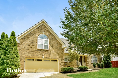 A house with a garage door that says Firstkey Homes.