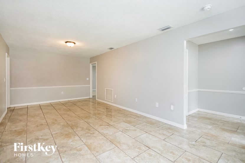 the living room and dining room are spacious and empty