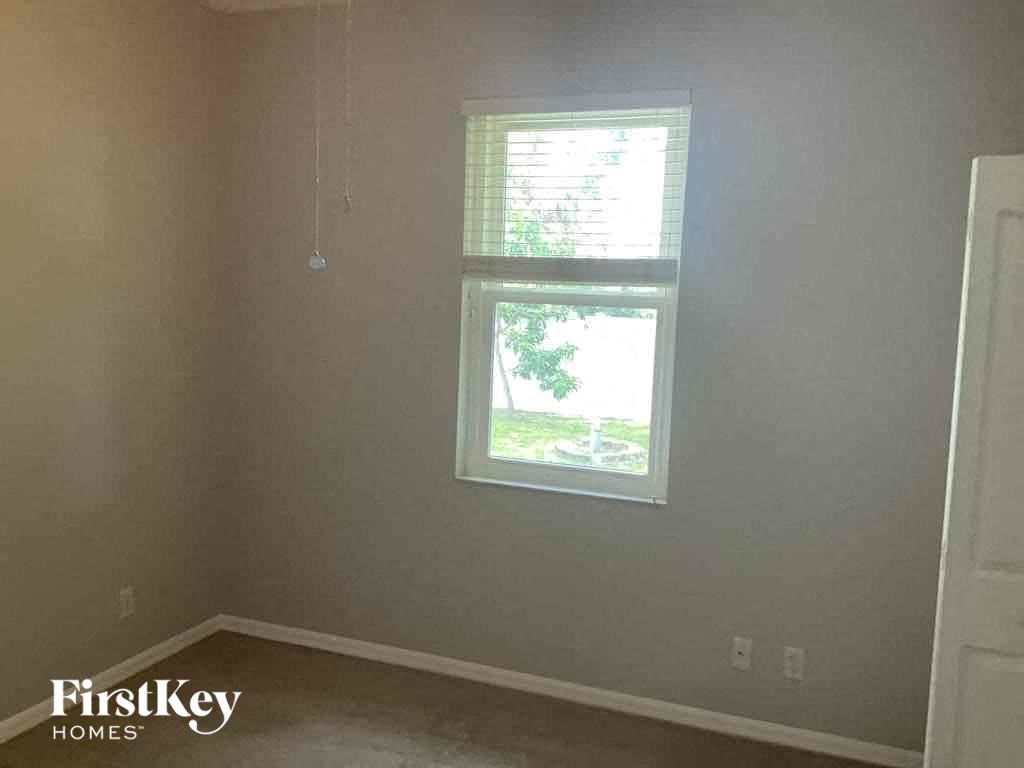 A room with a window and a FirstKey Homes logo.