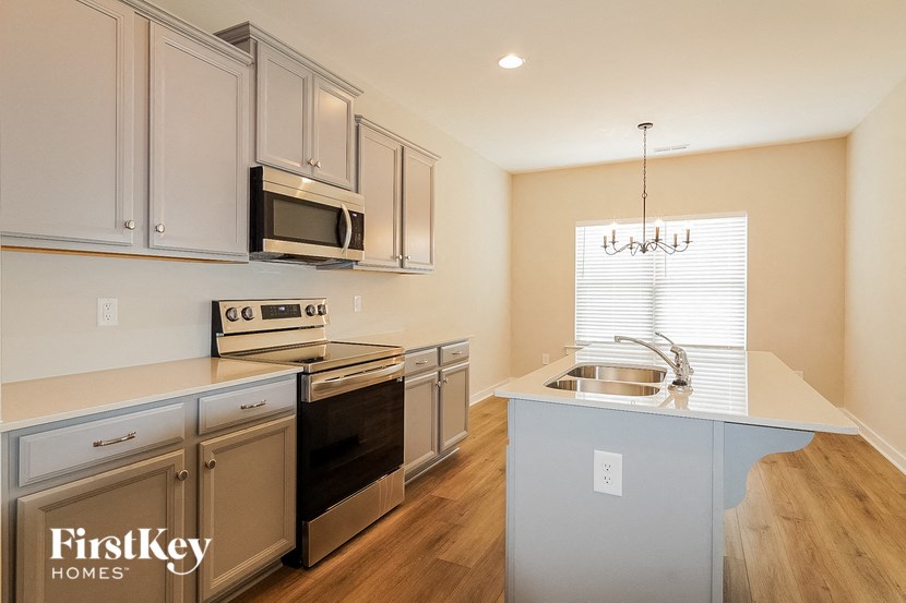 a kitchen with stainless steel appliances and a sink