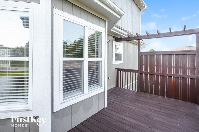 A wooden deck with a FirstKey Homes sign.