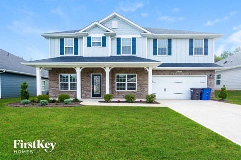 a large house with a lawn in front of it