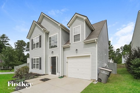 A two-story house with a garage is for sale by FirstKey Homes.