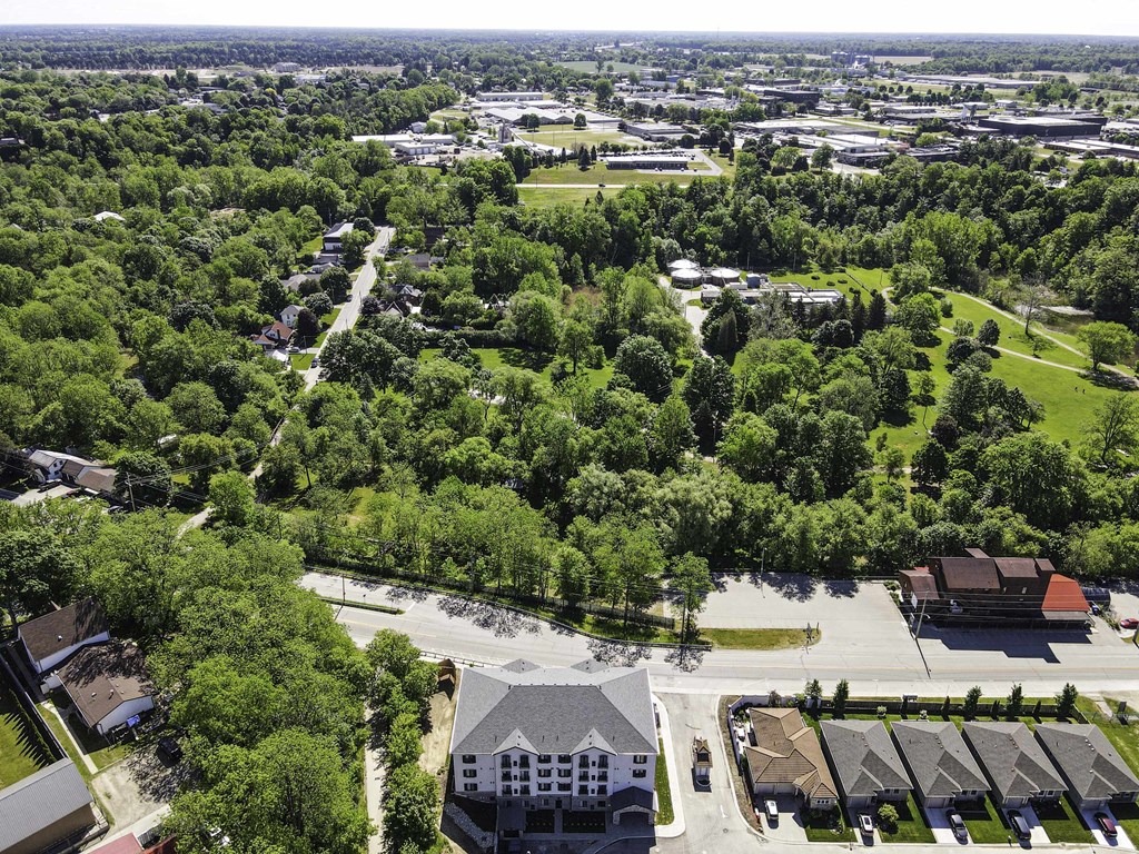 an aerial view of a neighborhood with houses and trees