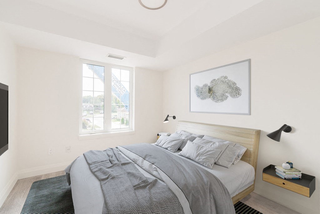 a bedroom with a bed and a window