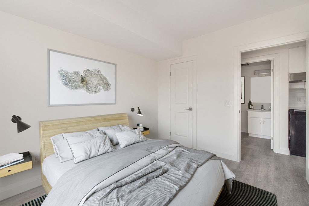 a bedroom with a bed and a closet