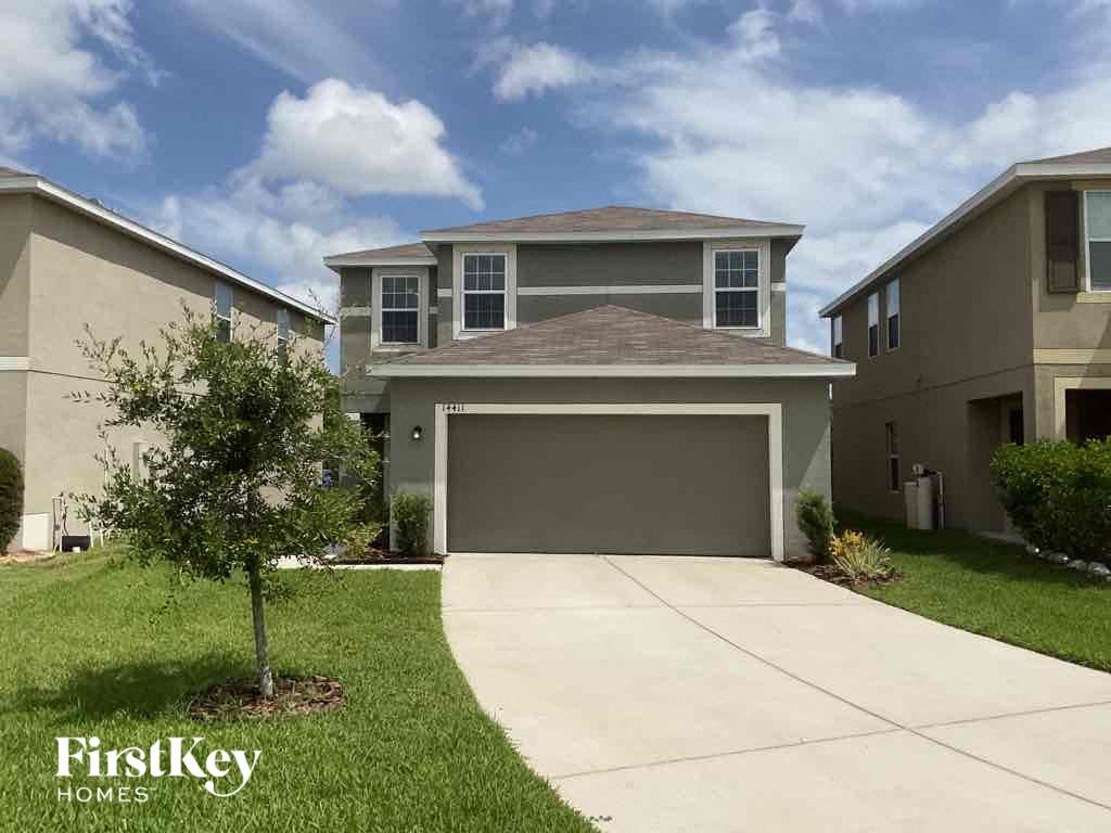A house with a garage is for sale by FirstKey Homes.