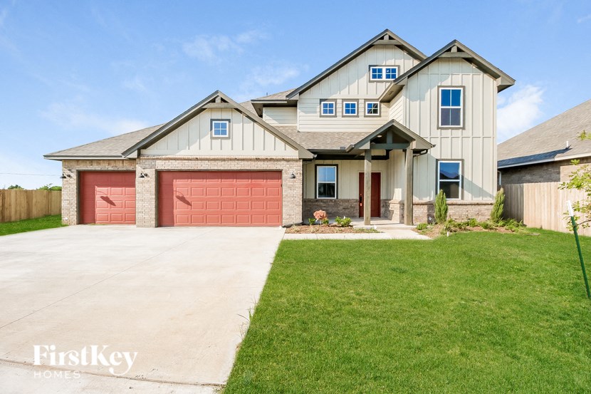 a house with a red garage door in front of it