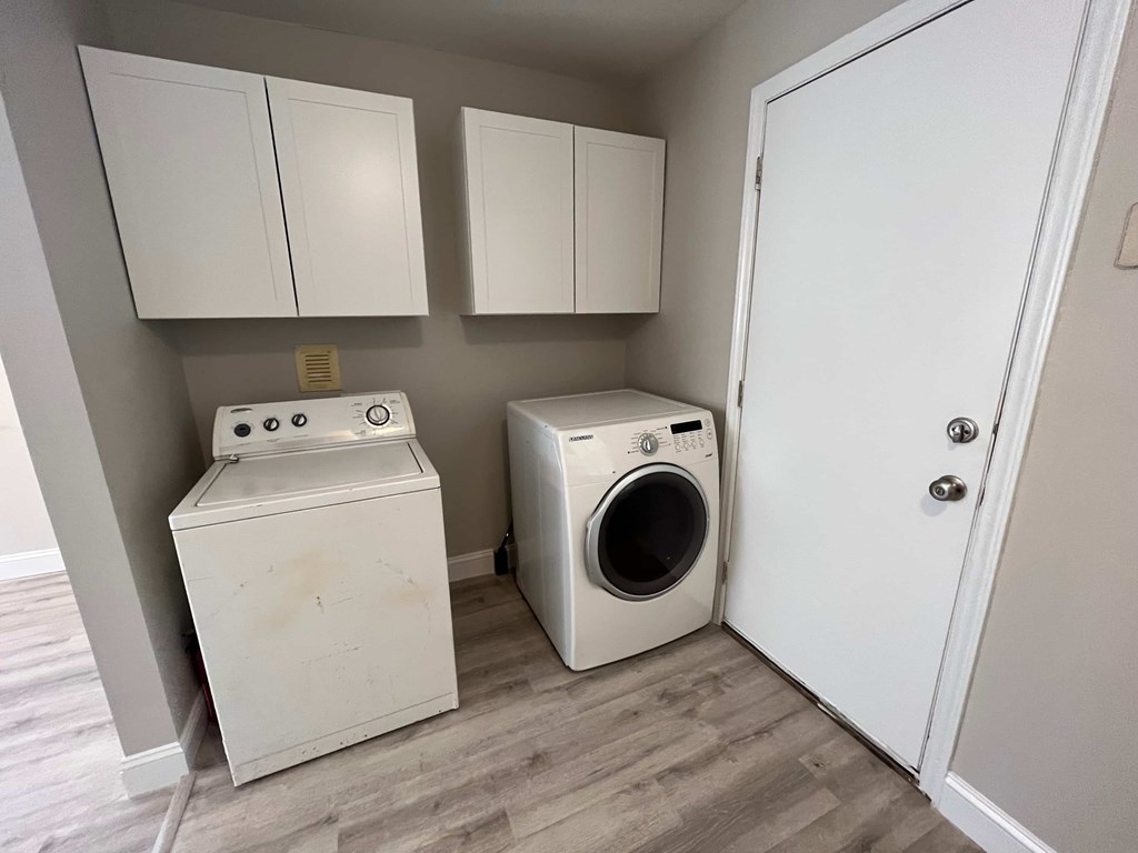 a laundry room with a washing machine and a dryer