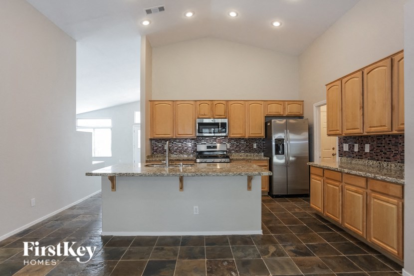 a kitchen with wooden cabinets and a counter top