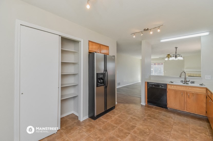 the kitchen is open to the living room and dining room