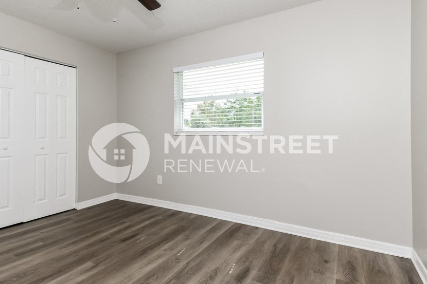 a room with a white wall and a white door