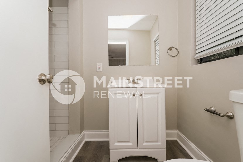 a small bathroom with a shower and a toilet